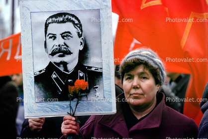 Woman holding up Stalin Poster, Pro Communism Rally, Moscow, Russia