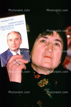 Woman holding up Gorbachev Picture, Pro Democracy Rally, Moscow, Russia