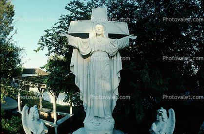Christ Statue, cross, angels