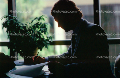 Man, writing, suit, desk