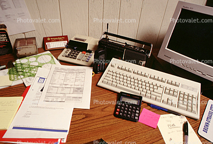 calculator, keyboard, radio, clutter, radio, cordless phone, desk, paperwork
