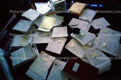 Desk full of Paper, Paperwork, stacks, clutter, confusion