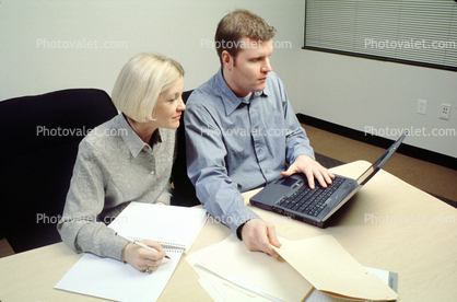 Laptop Computer, file folder, woman, man, meeting