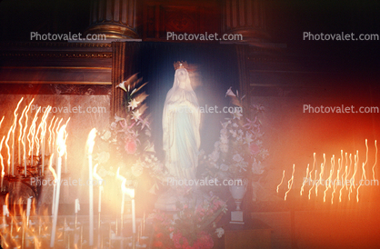 Mother Mary with candlelight swirl, La Madeleine Church