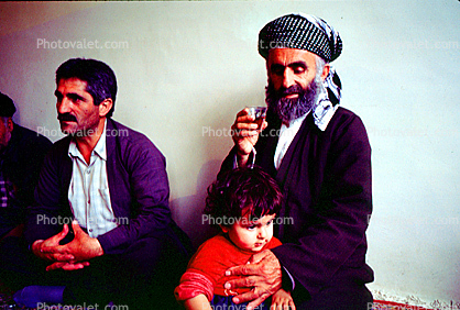 Dervish with his child, Nejar, Kurdistan, Iran