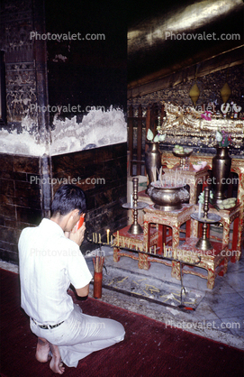 Man Praying, Buddhist Altar, shrine, Bangkok Thailand