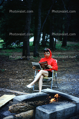 Campfire, Reading a Magazine, Woman, July 1966, 1960s