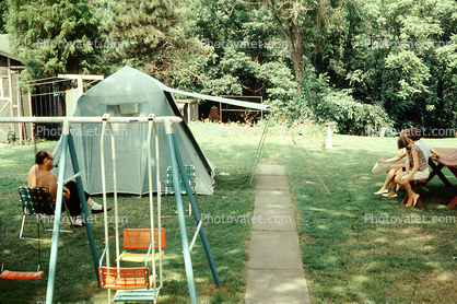Backyard Camping, tent, swing set, girls, man, lawn, July 1967, 1960s