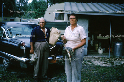 Cadillac Car, Fishing, Woman, Man, 1960s