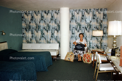 Room, Inside, Sitting, Woman, PanAm Bag, Carpet, Chairs, Beds, Sheets, Drapes, Lamp, 1960s