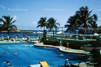 Swimming Pool, Ocean, Poolside, Hilton, Water, Palm Trees, Exterior, Outside, Waves, Swimmers, 1960s