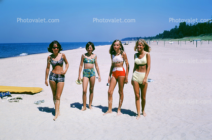 Girls walking on the beach, sand, June 1964, 1960s