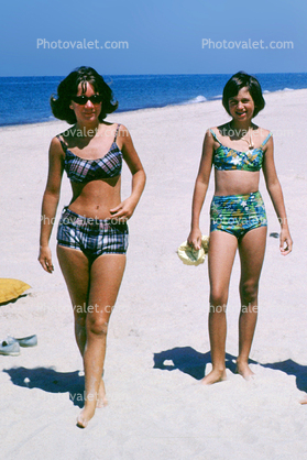 Girls walking on the beach, 1960s