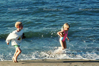 Girl and Boy playing in the water