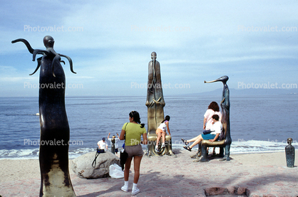 statues, people, ocean