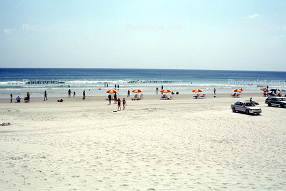 beach and sand, Atlantic Ocean, umbrellas, cars, waves