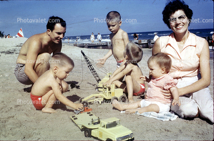 Playing on the Beach, Toys, Woman, Father, son, shirtless, smiles, retro, 1950s