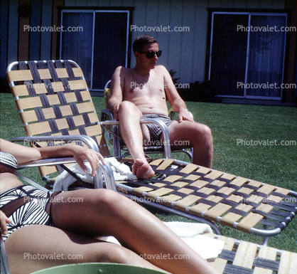 Woman and Man relaxing on a lounge chair, 1950s