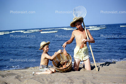 crab fishing, sand, beach, water, ocean, net, boys, hats, boats, Woodland Beach, 1950s