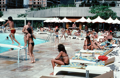 Swimming Pool, Poolside, lounge chairs, umbrellas, parasol, 1977, 1970s