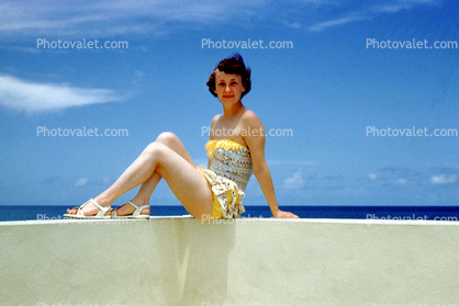 Woman sitting on a Wall, 1950s