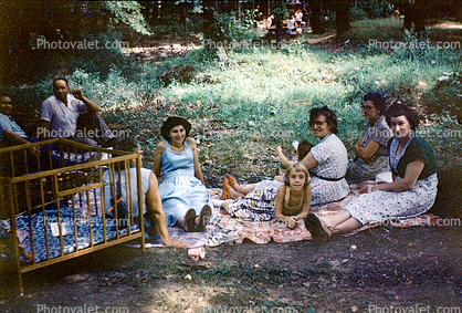 Backyard, Women, Girl, Crib, blankets, lawn, 1950s