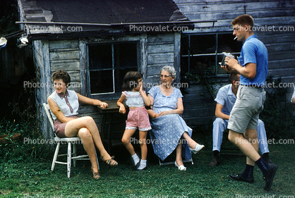 sitting folk, cabin, smoker, 1950s