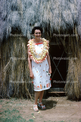 Woman, Lei, Flowers, Smiles, grass hut, 1962, 1960s