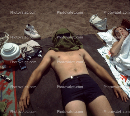 Man on the Beach, sun worshipper, swim trunks, swimsuit, shirtless, funny, beach towel