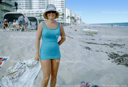 Woman on the Beach, hat, one piece bathing suit, swimsuit, 1960s