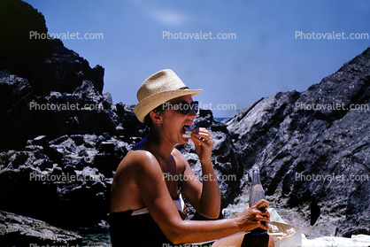 Woman Eating at the Beach