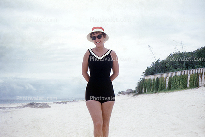 Woman on the Beach, hat, one-piece swimsuit, 1950s