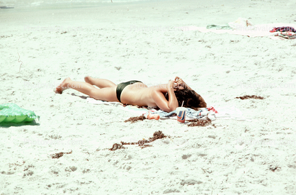 Woman laying in the sun, beach, tanning, sun worshippers