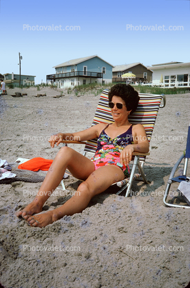Woman Lounging on the Beach, chair, sand, Houses, shore