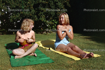 Girls having fun, backyard, 1960s