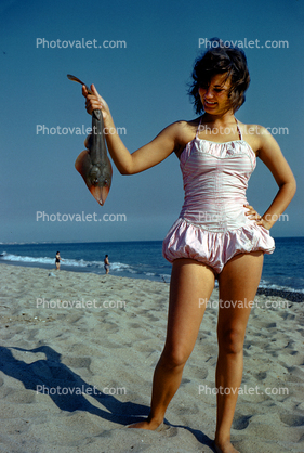 Girl with a Guitarfish catch, bathing suit, 1950s