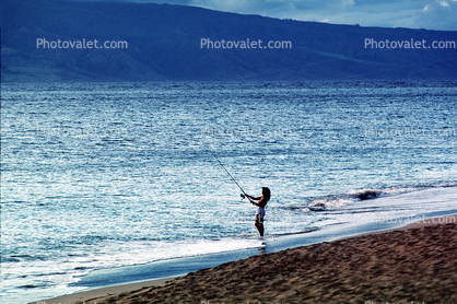 woman, female, ocean, sand, sandy, beach, fishing pole, rod and reel