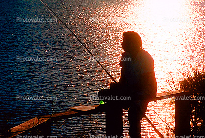 Peaceful sunset, fisherman