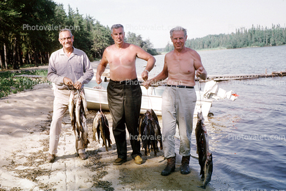 fishermen, man, lake, beach, forest, woods, fish catch, Nungesser, fish, Ontario, Canada, 1970, 1970s