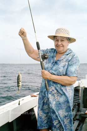 fisherwomen, woman, fish catch, hat, dress, smile, Outer Banks, North Carolina, 1965, 1960s