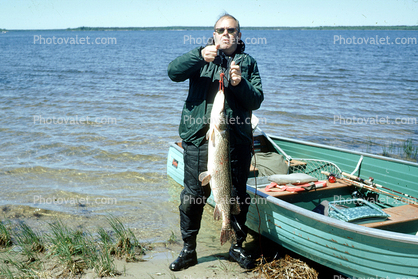 Fish Catch, Man, lake, boat, shore, shoreline, water, 1970, 1970s