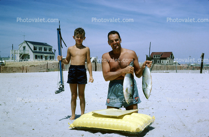 Boy with a Spear Gun, swim trunks, raft, Fish, Beach, Sun Tan