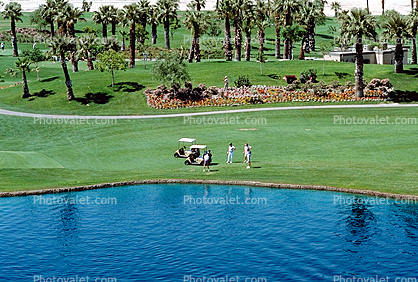 paths, water hazard, lake, golfer, golf cart, trees, Palm Desert, California
