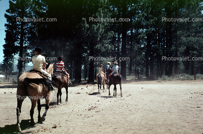 Girls riding horses, California, 1950s