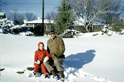 Father and Daughter Sitting in the Snow, 1950s