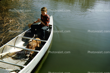 Boy Paddling a Canoe