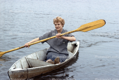Lady Paddling a Canoe