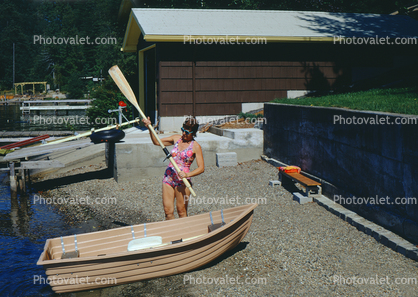 Woman with Oar Paddle, Rowboat, shore