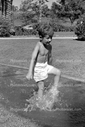 Boy running, splash, 1950s