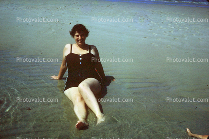 Lady sitting in water